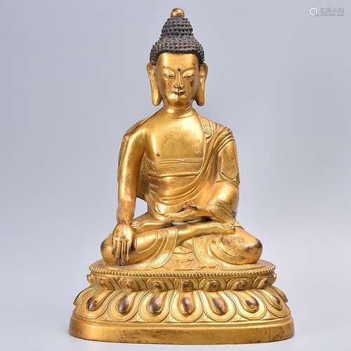 A GILT-BRONZE FIGURE OF SHAKYAMUNI