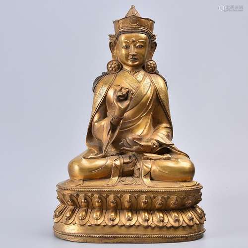 A GILT-BRONZE FIGURE OF BUDDHA