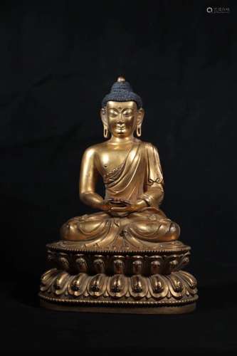 A GILT-BRONZE FIGURE OF SHAKYAMUNI