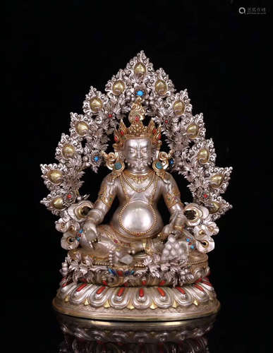 18TH CENTURY, A TIBETAN YELLOW JAMBHALA DESIGN SILVER STATUE