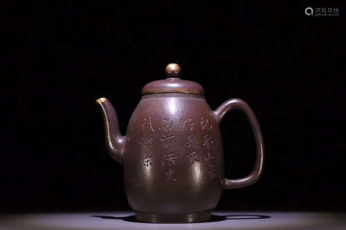 A WORD-CARVING TEAPOT
