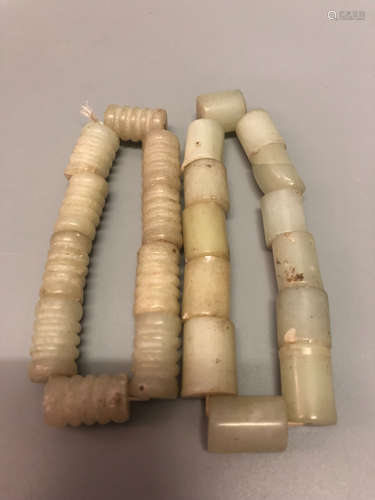 A PAIR OF STRING OF HETIAN JADE HANDPIECE