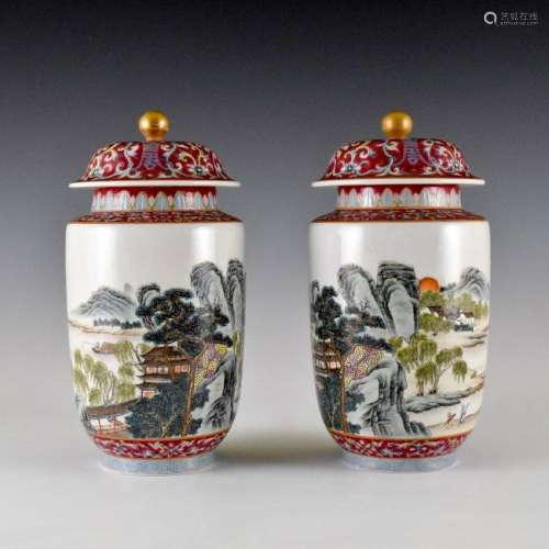 PAIR OF LANDSCAPE MOTIF FAMILLE ROSE LIDDED JARS