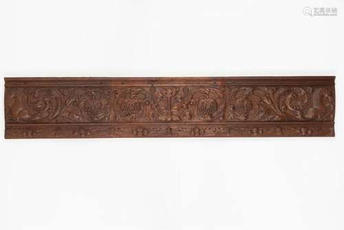 AN EARLY CARVED OAK PANEL