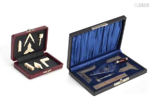 TWO CASED MASONIC MINIATURE SETS OF WORKING TOOLS