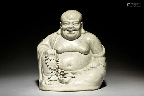 CELADON GLAZED AND IMPRESSED 'MAITREYA BUDDHA' SEATED FIGURE