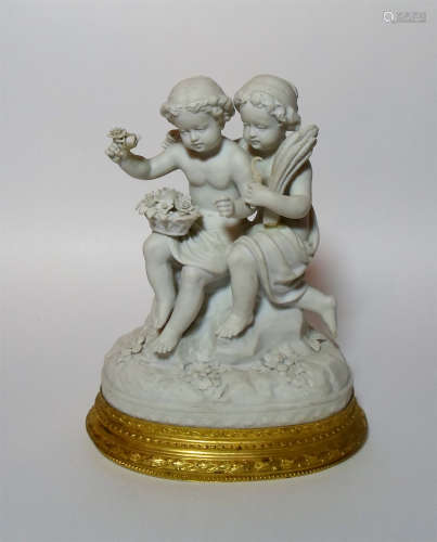 A Biscuit Porcelain Group on Gilt Bronze Base, created for Sevres.
