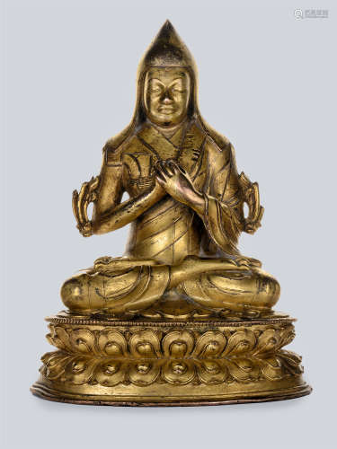 An inscribed Gilt Bronze Figure of Lama, Tibet, 18th Century or Earlier.
