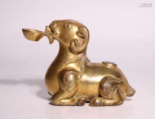A SHEEP SHAPED GILT COPPER WATER DROPPER