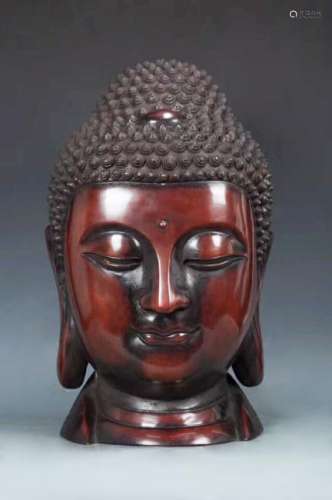 A BRONZE MOLDED BUDDHA HEAD FIGURE