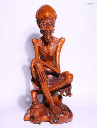 A HUANGYANG WOOD CARVED LUOHAN FIGURE