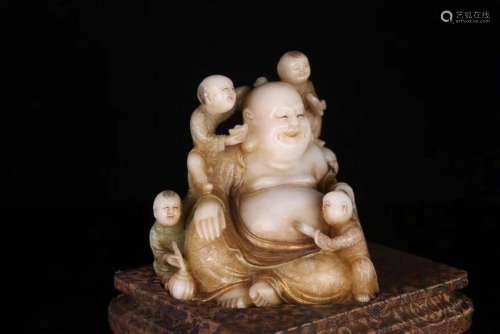 A SOAPSTONE CARVED LAUGHING BUDDHA STATUE
