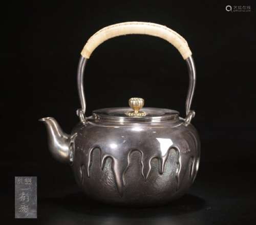 A SILVER MOLDED HANDLE WATER POT