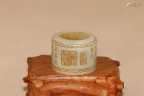 A HETIAN JADE CARVED THUMB RING