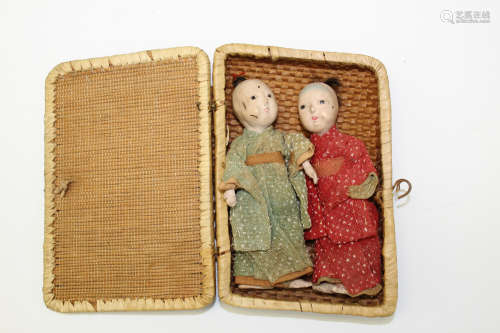 Two Japanese Miniature Dolls in a Bamboo Box.