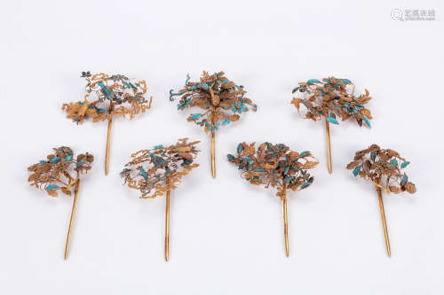 Group of seven Chinese gilt bronze hair pins.