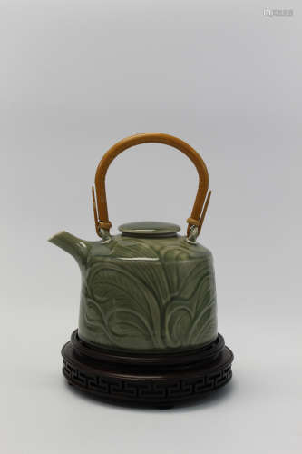 Teapot - porcelain with celadon and green glaze in swirling pattern.  Signed by artist - Molly Lowall 1978. Stand included.