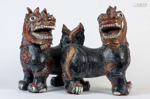 Pair of 19th C Indonesian carved and painted wood foo dogs. 16 in H and 14 1/2 in L.