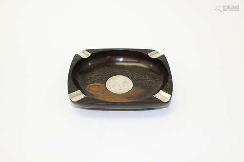 Wood ash tray with coin inlaid.