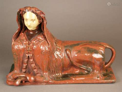 Ceramic figurine ''Sphinx'' - glazed, polychrome painted, fully plastic representation of a<br />lying sphinx woman, on rectangular plinth, glaze rubbed in places, HxLxB: ca.29x41x17cm