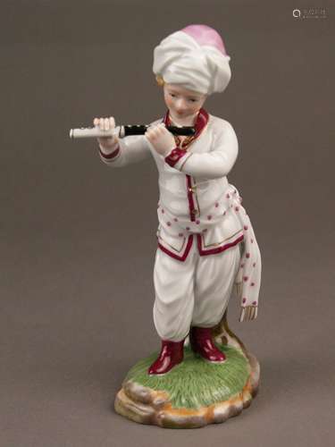 Musician from ''The Turkish Orchestra''- Hoechst, Germany, blue wheel mark with painter's<br />mark 'Tö 271', 20th century, flute player, porcelain, glazed, polychrome painted and gilt, white jacket, on naturalistic pedestal, design by Johann Peter Melchior (1747-1825 ), H.ca.18cm