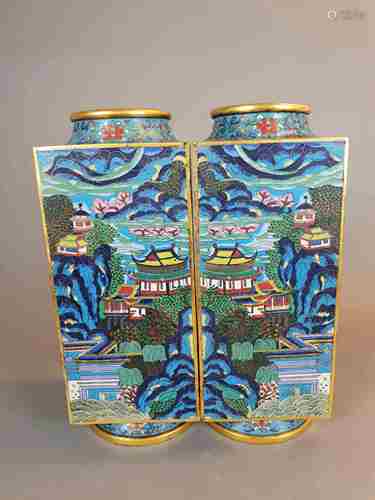 A Pair of Rare Cloisonné Enamel Square 'Landscape' Vases - of cong-shape, China, early<br />19th century, each with four panels to the body, these panels are elaborately decorated against a turquoise ground with two different scenes of pavilions in a idyllic mountainous landscape setting amidst large rockwork, rampant trees and ribbonlike clouds, on one scene an angular bridge over a lake leads to a pavilion standing on a platform supported on pilings, on another some pilgrims seem to be on their way to the top of the mountain, the shoulder, neck and pedestal foot similarly worked to show lotus scroll on a turquoise ground, bearing a four-character Qianlong mark to the underside (emperor 1736-1795), approx.12,59 in. (32 cm) high, only slight wear to the gilt and chipping to the enamels due to age