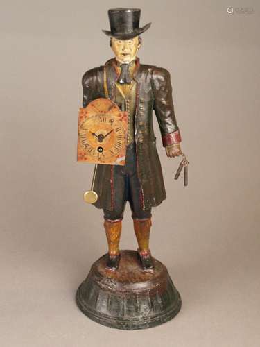 Figure clock ''watch seller'' - Black Forest, metal, polychrome painted, around 1900, watch<br />seller with small clock on his back (not working) and Black Forest clock in front of the chest, works, pendulum and key new, base glued, signs of age or wear, H .ca.38cm