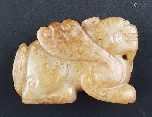 Jade carving - full round carving of a winged mythical beast, called bixie,<br />caramel-colored jade with brownish color inclusions, a round drilling to the body, left front paw slightly chipped, China 20th century, c.4x5,5 cm