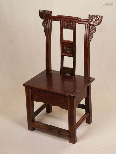 Chair - China, in the style of the hatchairs, central stripe of the backrest with three<br />small inserted panels, the ends of the upper frame with large carved lotus flowers, below that ruyi motifs, rectangular seat, square legs, wood stained and varnished, signs of age and use, lacquer coating partly heavily rubbed with splinterings, H. (backrest / seat) approx. 93.5 / 42.5cm