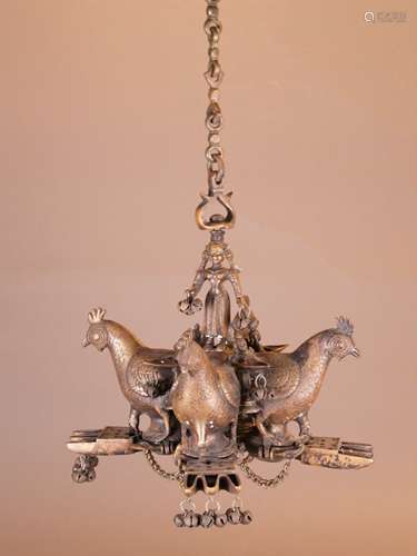 Hanging oil lamp - India 20th cent., heavy bronze casting, traffic light in the form of<br />four fully plastic birds, probably peacocks hanging on solid link chain with hook, four oil pans with several round openings, each chain with pin to the lock of the oil sump, shaft as fully plastic female figure, probably Lakshmi, bells hanging partly missing, H (without / with chain). ca.34 / 88cm, probably lamp for Lakshmi Puja, the most important day of the Hindu Diwali -Festival of lights