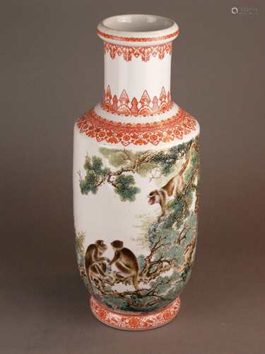 Large rouleau monkey &  pine vase - China, 2nd half of the 20th century, porcelain with<br />polychrome enamel decoration, painted with a rocky tree landscape featuring three curious monkeys on pine trees, chinese inscription and red seal, filigree red ornamental borders composed of  leaf, ruyi head and flower elements as well as bats and blooming lotus tendrils, style of Bi Yuanming (1907-1991), 4-character-mark to the base, height: approx. 46.5cm