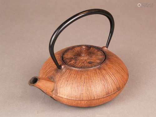 Teapot - marked, probably Japan, cast iron, pressed body, beak spout, flat lid, movable<br />bow handle, H. with handle 14cm