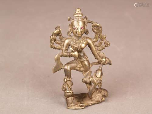 Figure of the Durga - India / Southeast Asia, bronze, brown patinated, fully plastic,<br />standing representation of the eight-armed Hindu goddess as the buffalo demon's killer, in her hands attributes, eyes set with 2 rubies, signs of age, H.ca.9,5cm