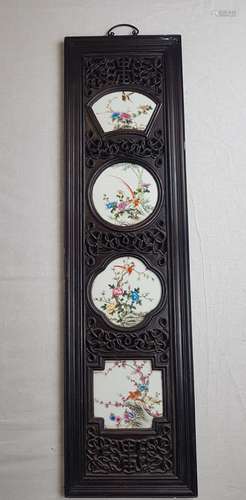 Wall panel with porcelain plates - rectangular wooden panel dark lacquered and<br />ornamentally carved, with four differently shaped porcelain plates with various flowering branches and flowers with bird paintings, China, ca.119x32cm, metal wall hanger, lacquer finish with signs of age / abrasion