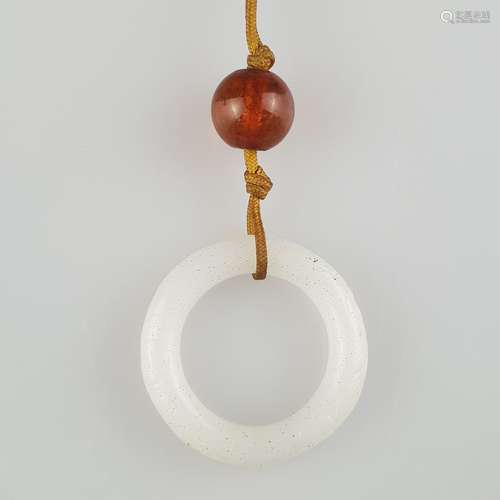 Ring-shaped Jade Pendant - China, Qing-dynasty, finely carved white jade ring with rounded<br />edges, polished, on the outside engraved, attached to a light brown cord, dm.c.3,5cm / weight c.8,5g