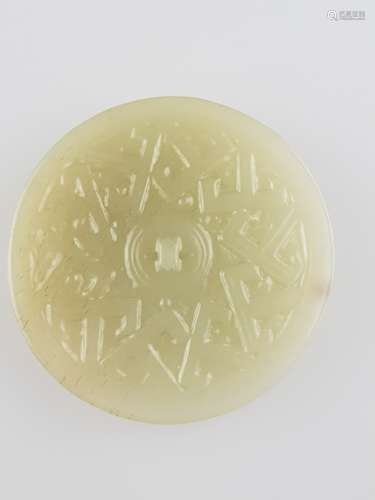 Small Jade Mirror - China, celadon green jade with minimal brown inclusions, finely<br />carved, dm.ca.6cm, ca.50g