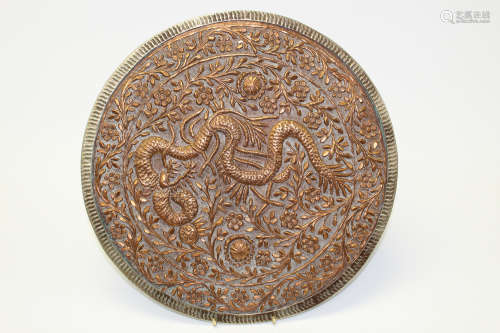 A Chinese brass dragon plaque.