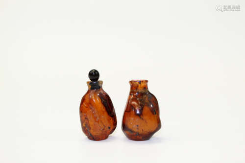 Two Chinese amber snuff bottles.