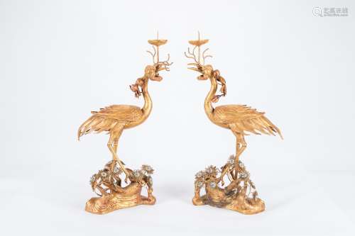 Pair of Chinese gilt bronze crane candle holders.