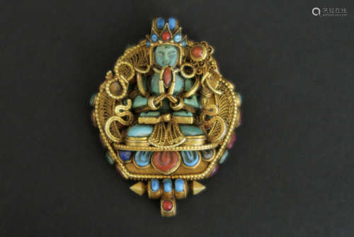 Tibetan “Kharachheri” ghau in gold on silver with lapis lazuli, turquoise and red coral with the representation of Kharachheri