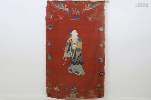 antique Chinese embroidery in silk (on a red handwoven canvas) with in the center the representation of one of the three Sages of happiness, affluence and (this one) longevity