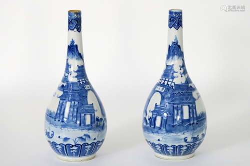 pair of 18th Cent. Chinese vases/bottles in marked porcelain with a blue/white harbor view  –  one badly restored and one with a hair