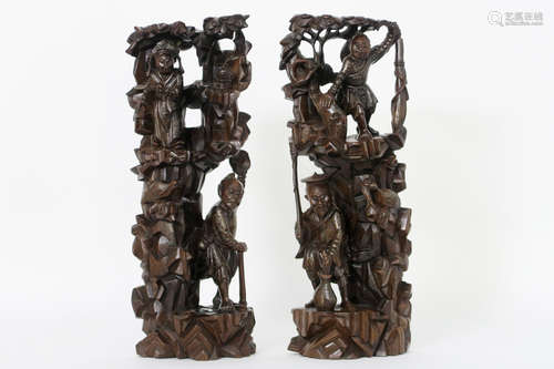 pair of Chinese sculptures in wood with silver inlay