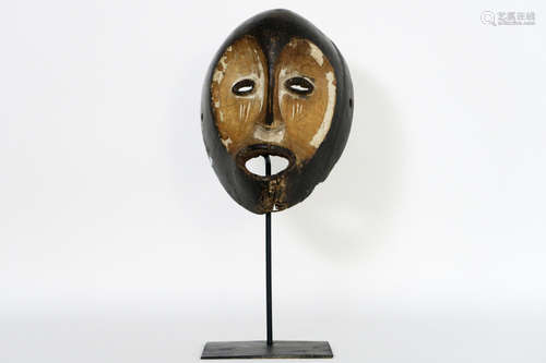 African Congolese ‘Lega’ mask in wood with remains of the original polychromy and with an old native restoration