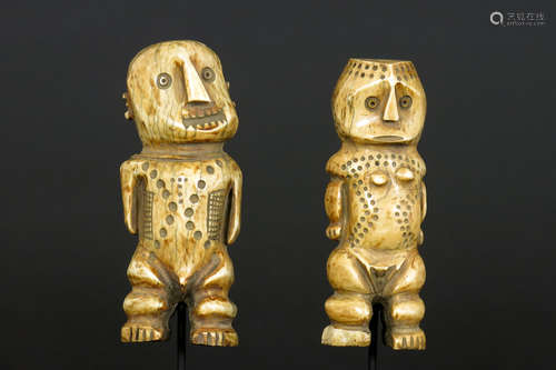 pair of African Congolese ‘Lega’ sculptures in ivory with nice patina : a female (maternity) one and a male one, each with scarifications