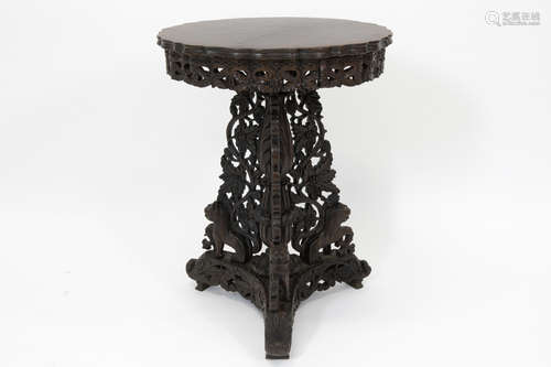 19th Cent. oriental occasional table in rosewood with a round top on richly carved stand