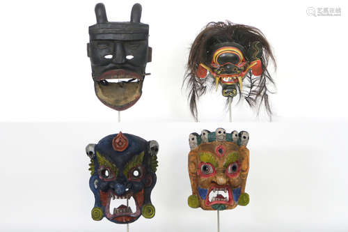 four masks in wood