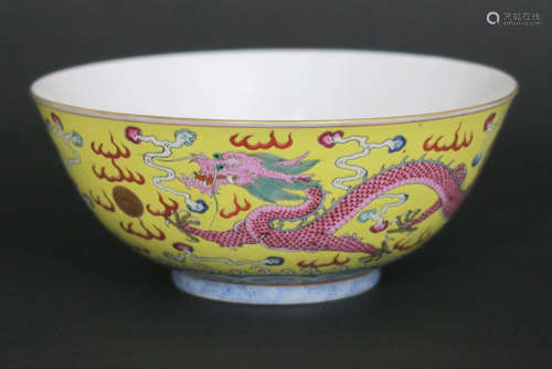 Chinese bowl in marked porcelain with a polychrome decor with dragons and phoenixes on a yellow background