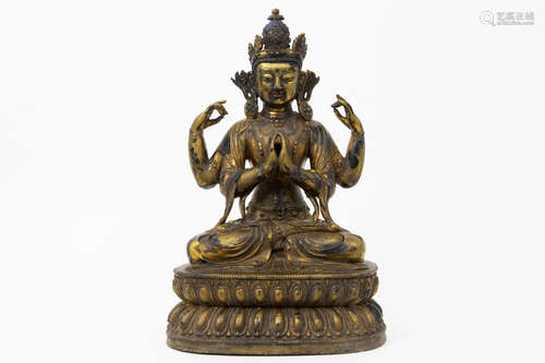 18th/19th Cent. Tibetan “Vairocana (crowned Buddha)” sculpture in solid, fire guilded brass