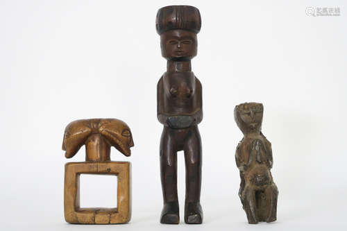 three African sculptures in wood with a “Luena” female figure and a “Luba” rub oracle